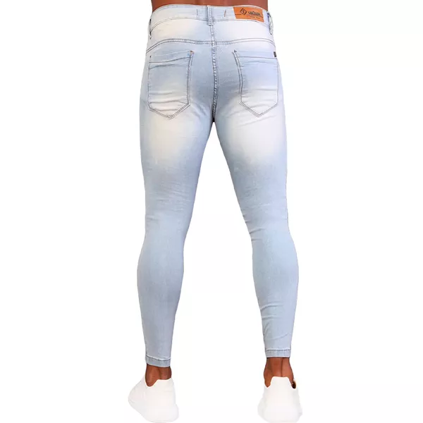 calça jeans dobrada na canela homem